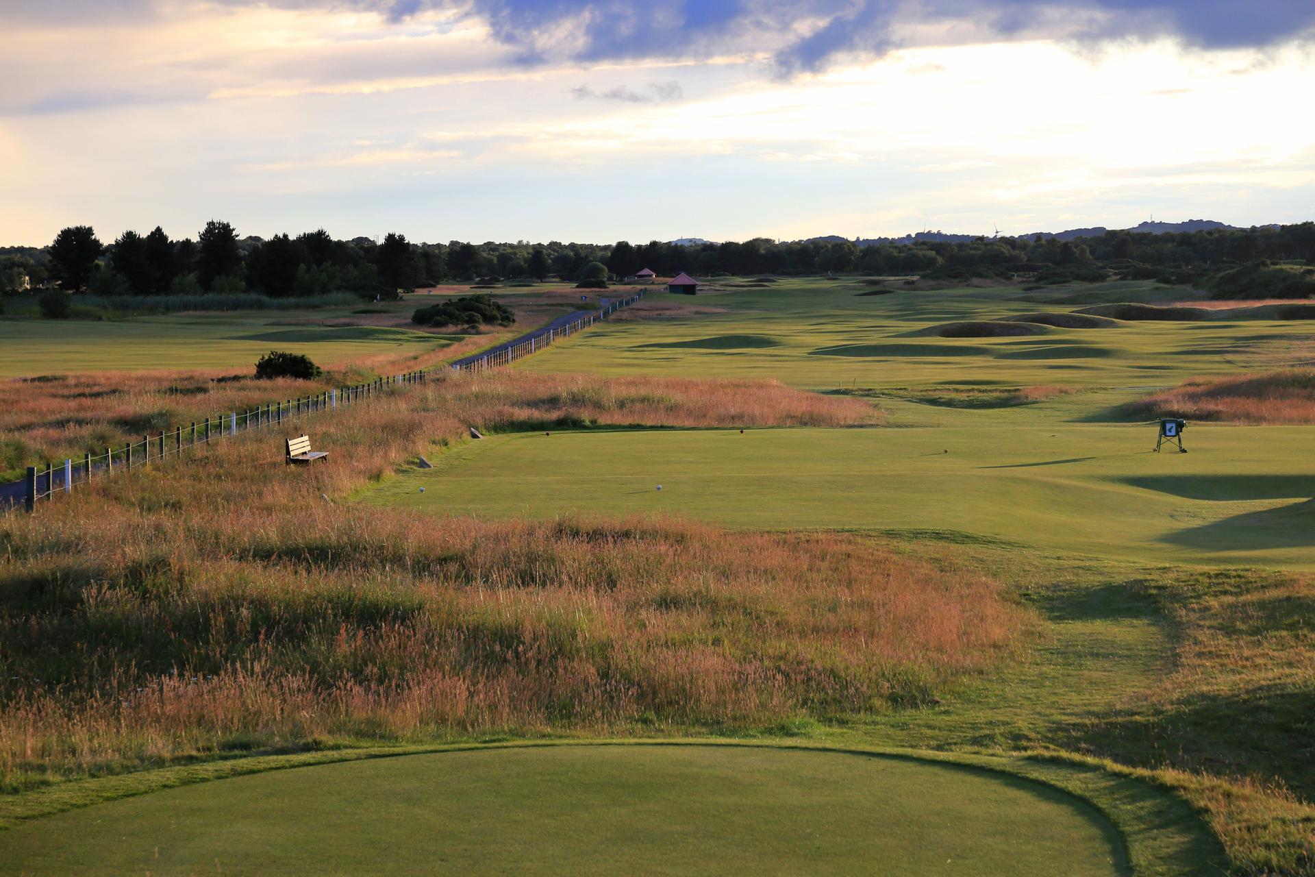 Overhead view of winding fairways leading to a smooth green