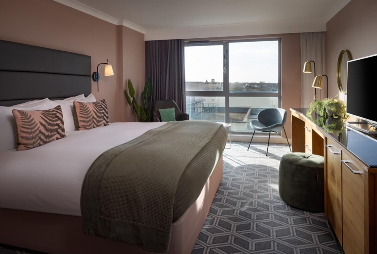 Modern double bed room with window view for natural light