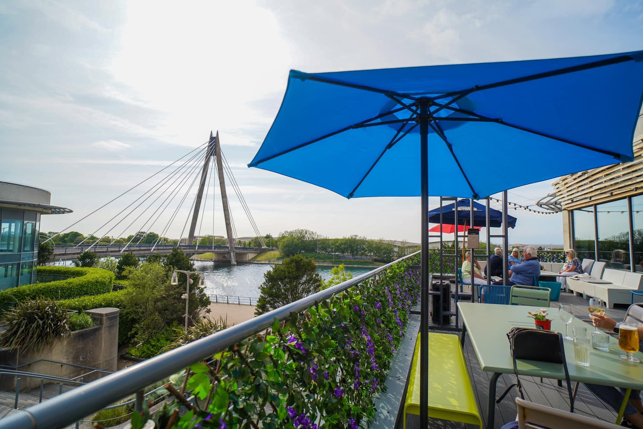 Rooftop lounging area at the hotel with river views