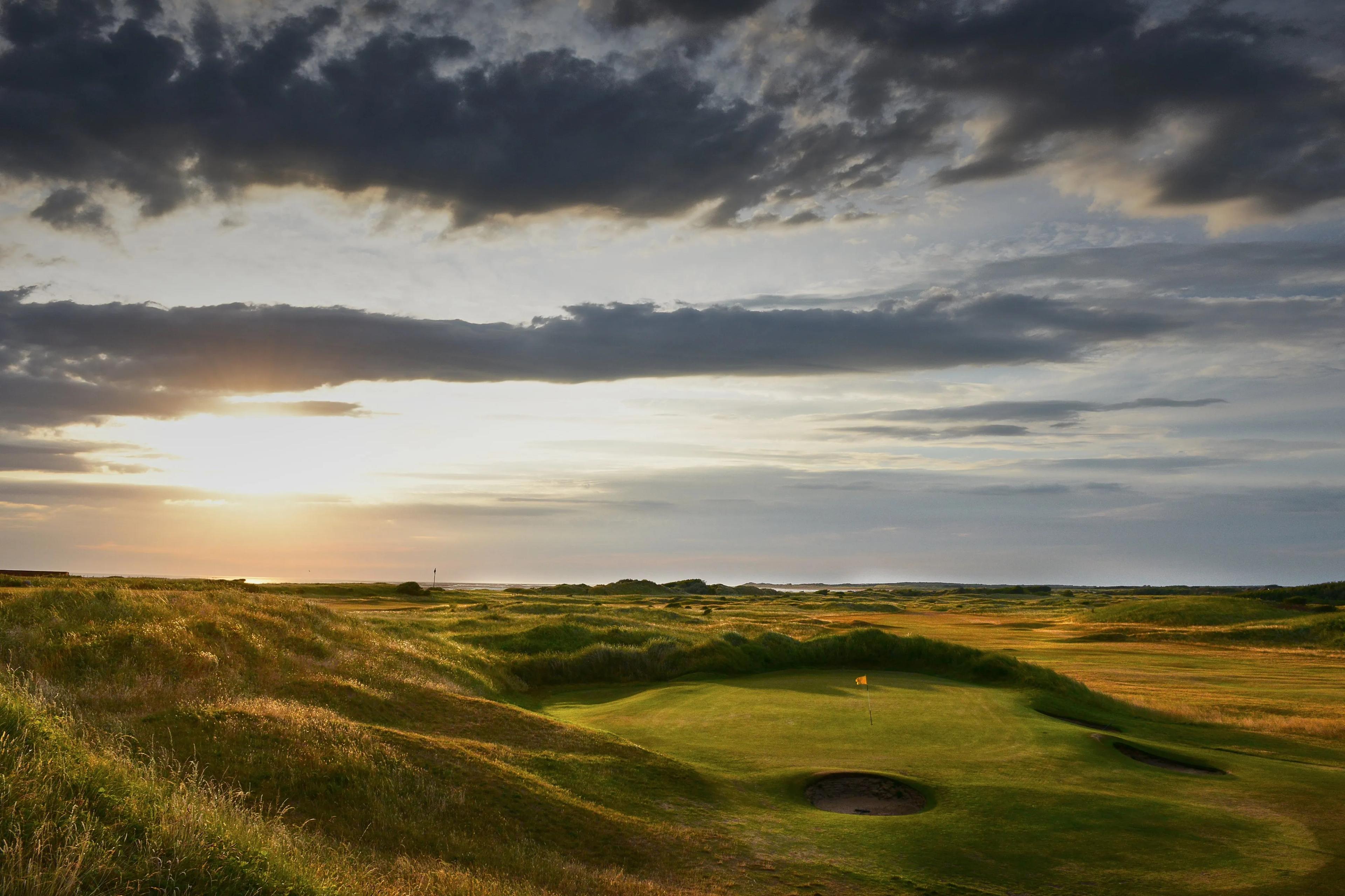 Sun setting over the course