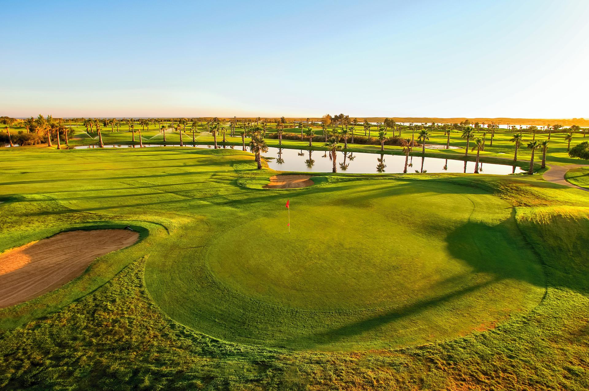 A well maintained fairway leading to a smooth green at the Marriott Residence Salgados Resort golf course