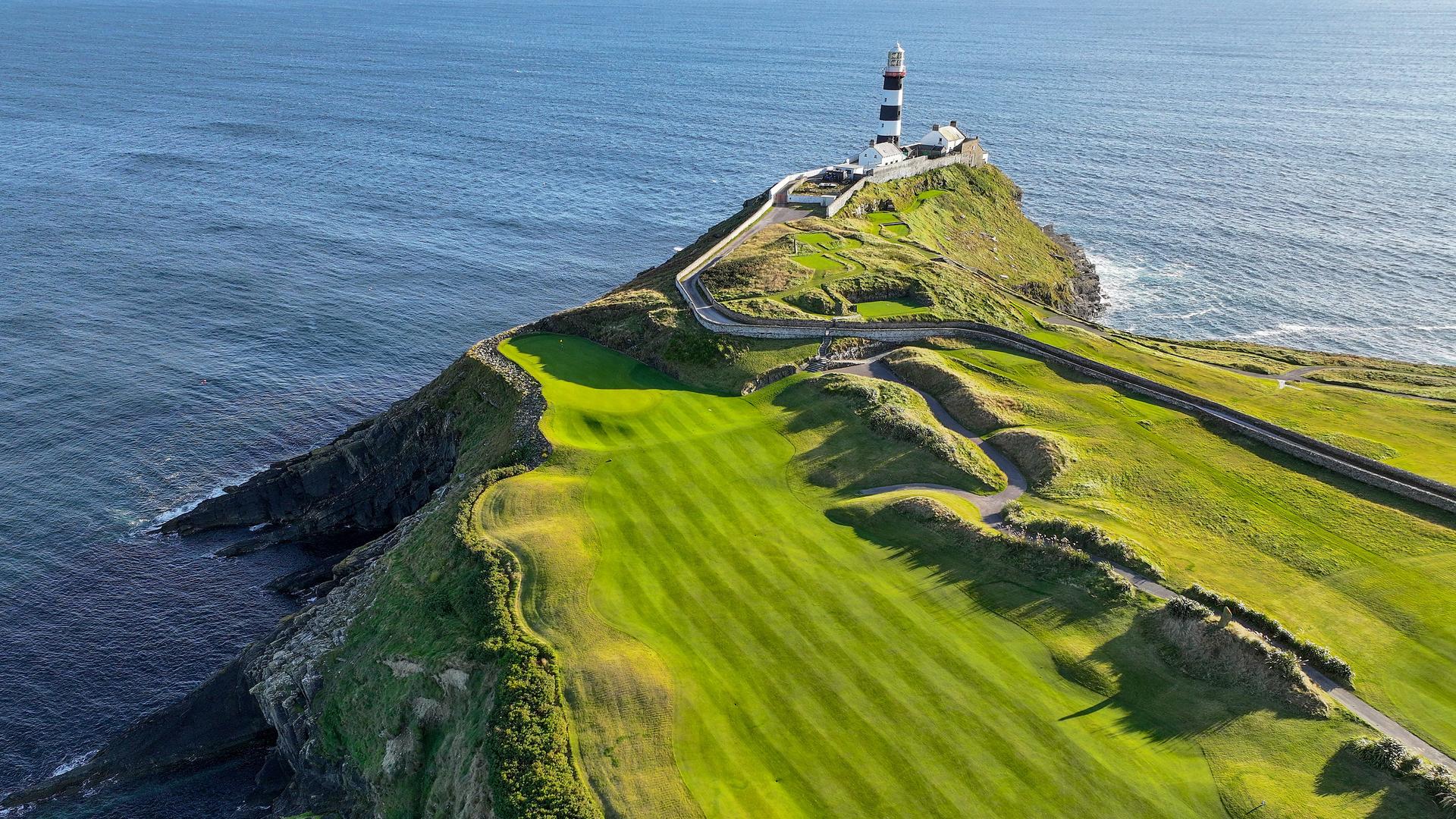 Overhead view of a well maintained fairway leading to a coastal green