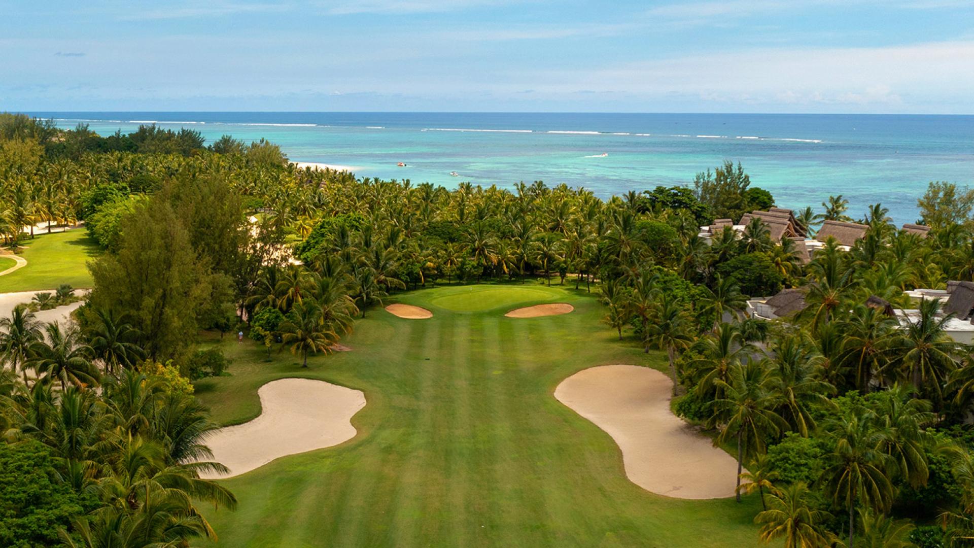Overhead view of a well maintained fairway nestled with sand bunkers