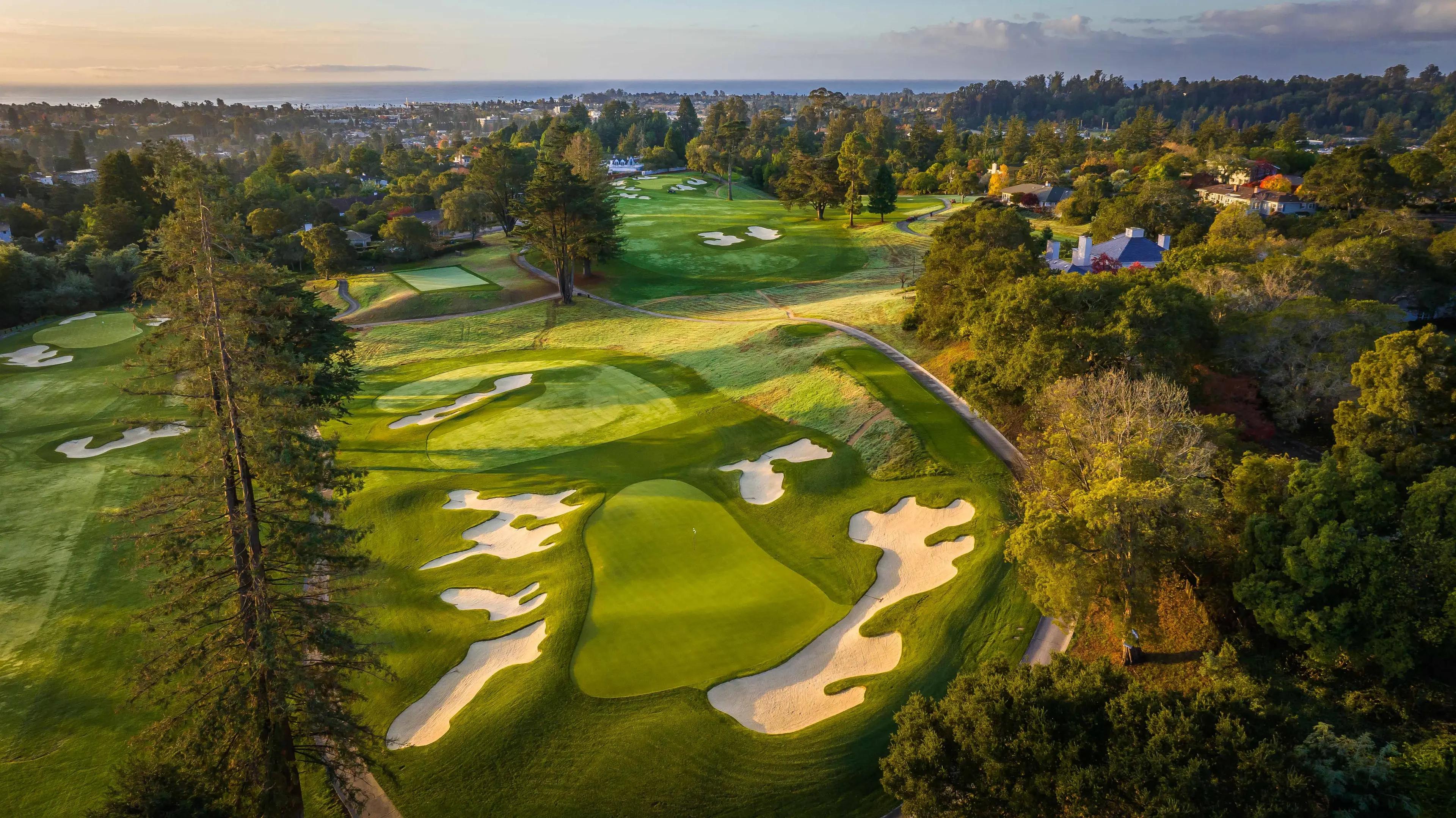Overhead view of a smooth green surrounded by sand bunkers