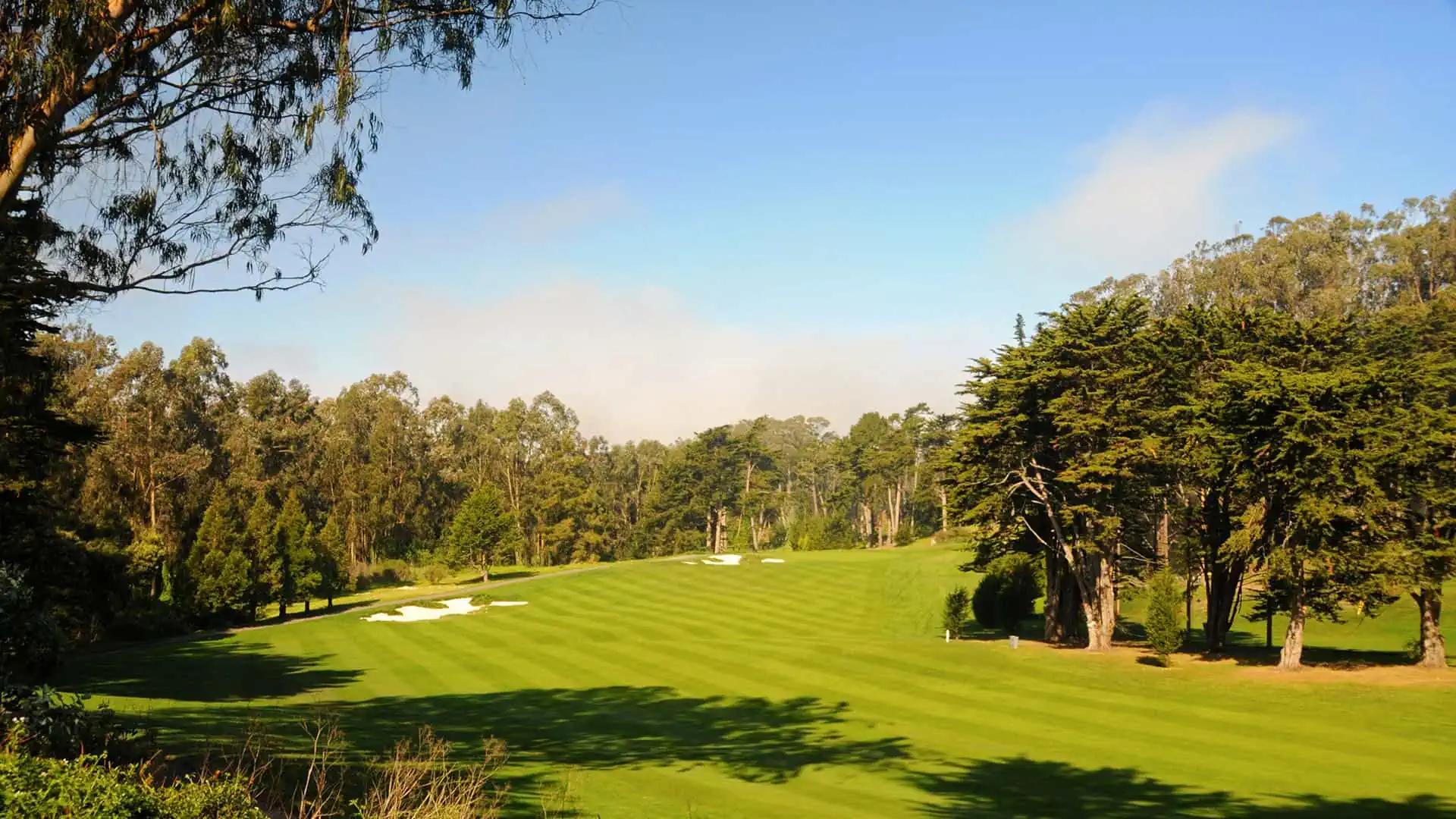 A winding fairway leading to a smooth green