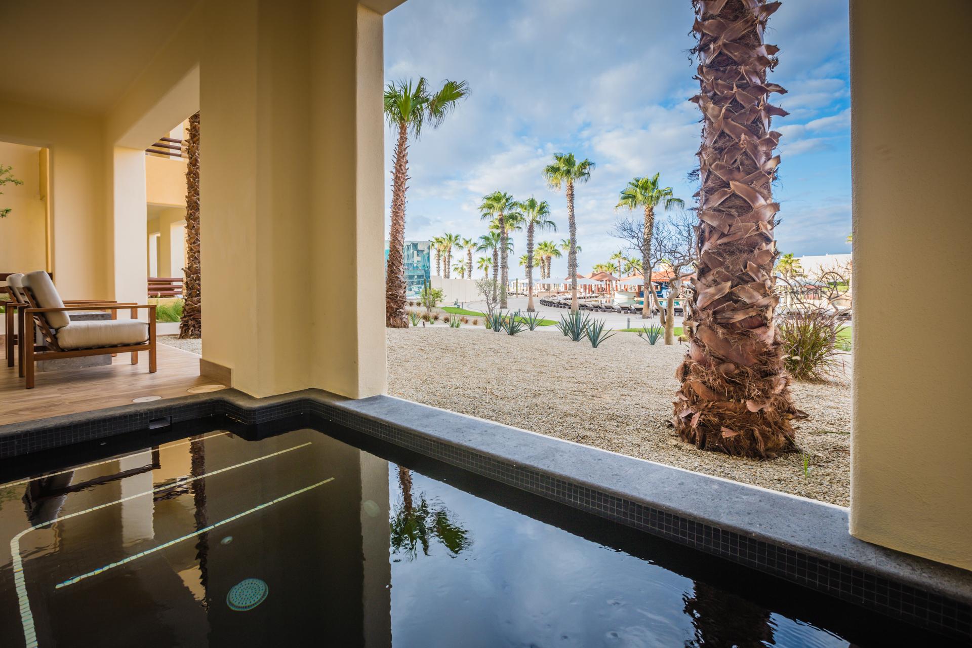 Panoramic view of palm trees nestled on the beach at Pueblo Bonito Pacifica Resort