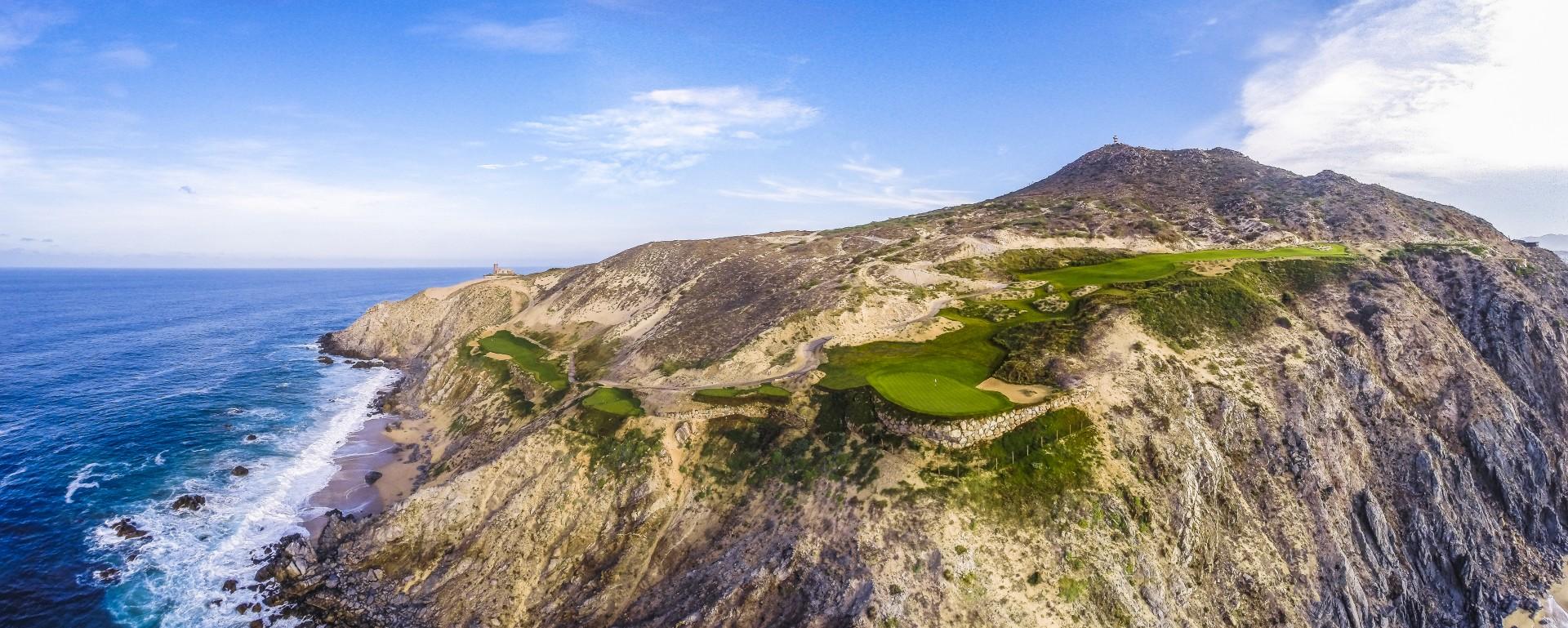 Overhead view of a well maintained fairway off the side of a mountain