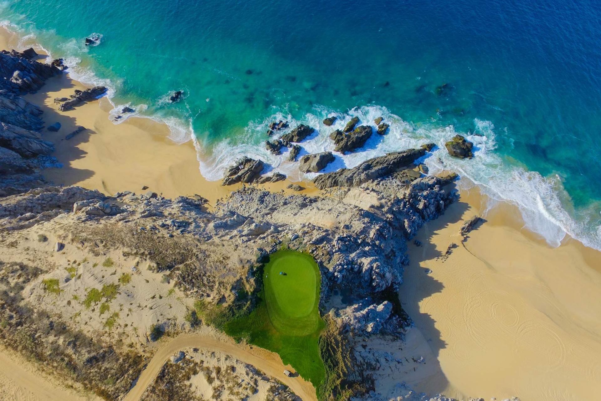 Birdseye view of a coastal green at Pueblo Bonito Pacifica Resort