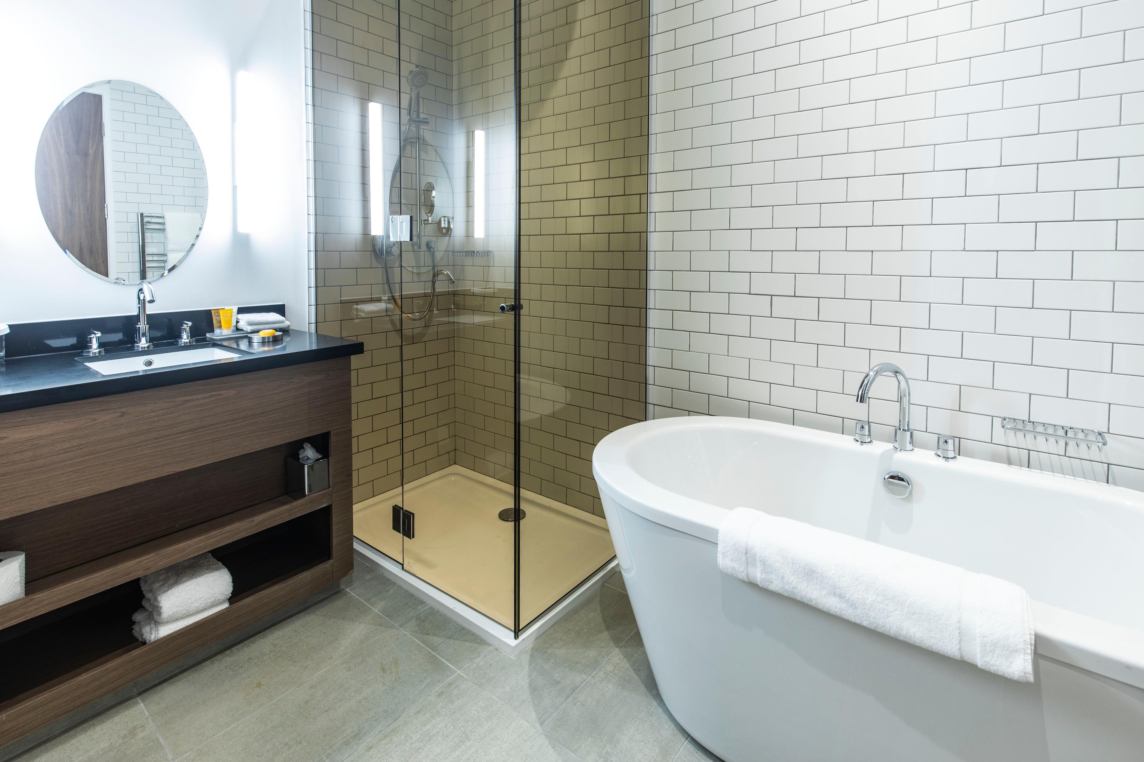Bathroom as part of a suite at Sandman Signature Aberdeen Hotel