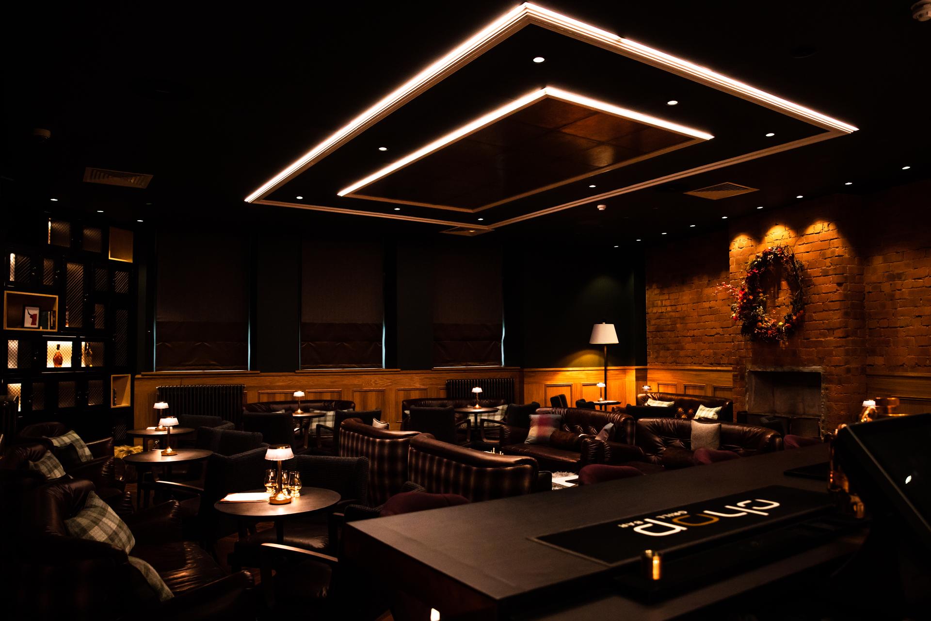 Indoor dining area and bar at Sandman Signature Aberdeen Hotel