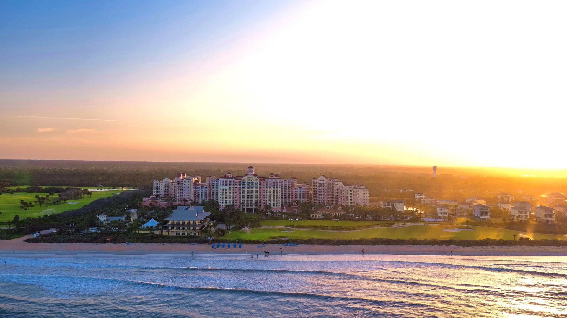 Panoramic view of hammock beach under sunset