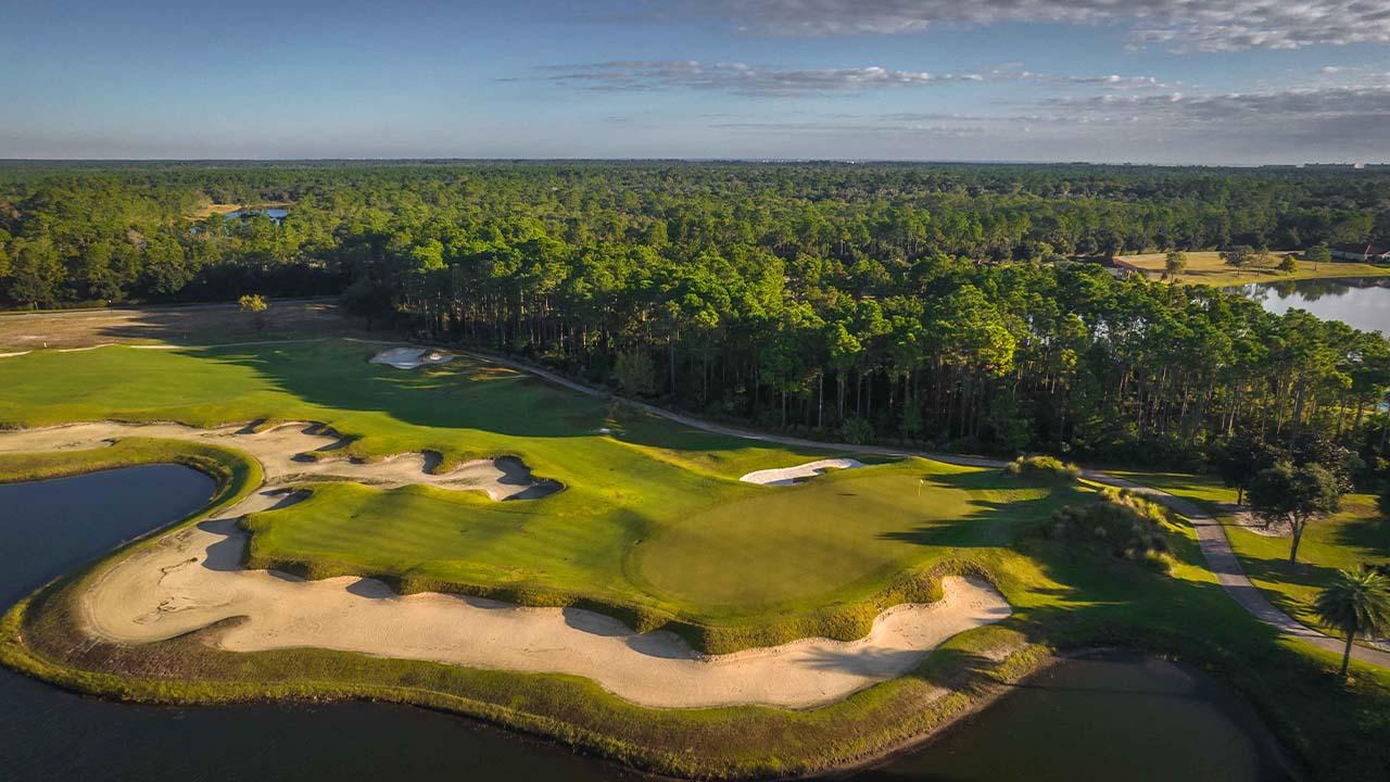 A smooth green surrounded by sand bunker at hammock beach