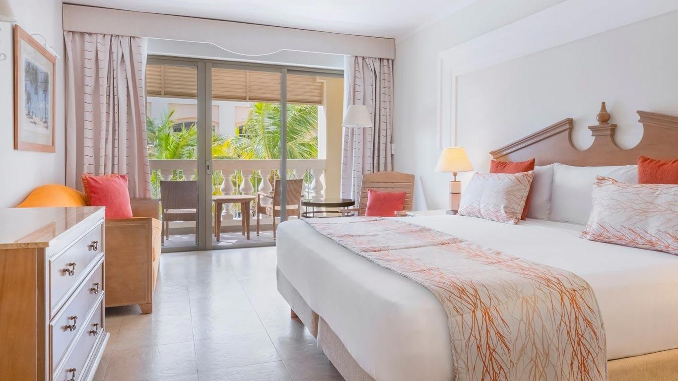 Double bed suite with balcony views at Iberostar Waves Rose Hall Beach