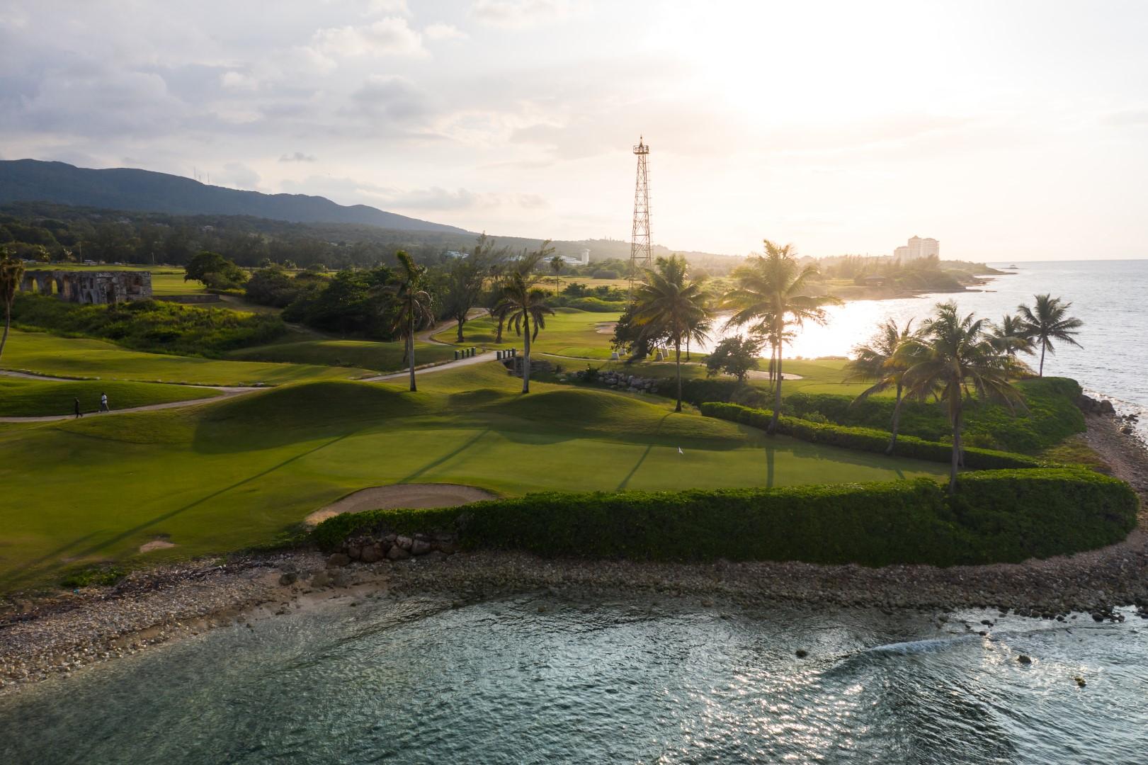 A well maintained fairway leading to a smooth green at Iberostar Waves Rose Hall Beach