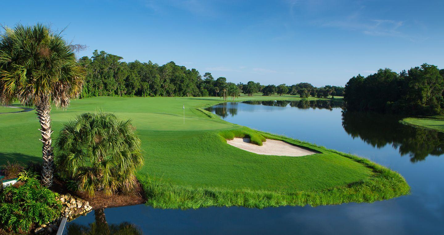 Wide fairway leading to a well maintained green with a strategically placed bunker just before the water hazard