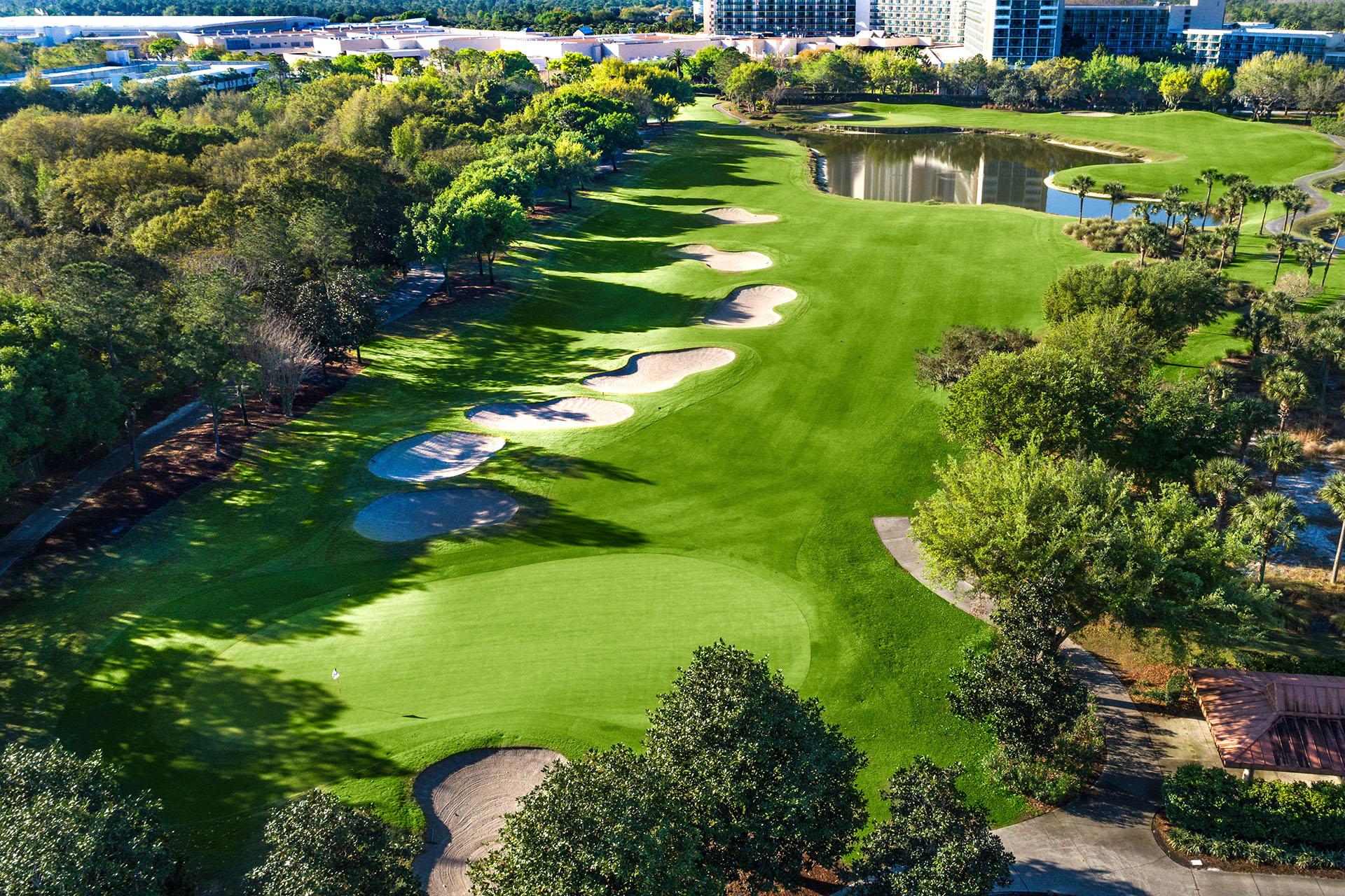 Birdseye view of the course with a line of sand bunkers leading up to the smooth green
