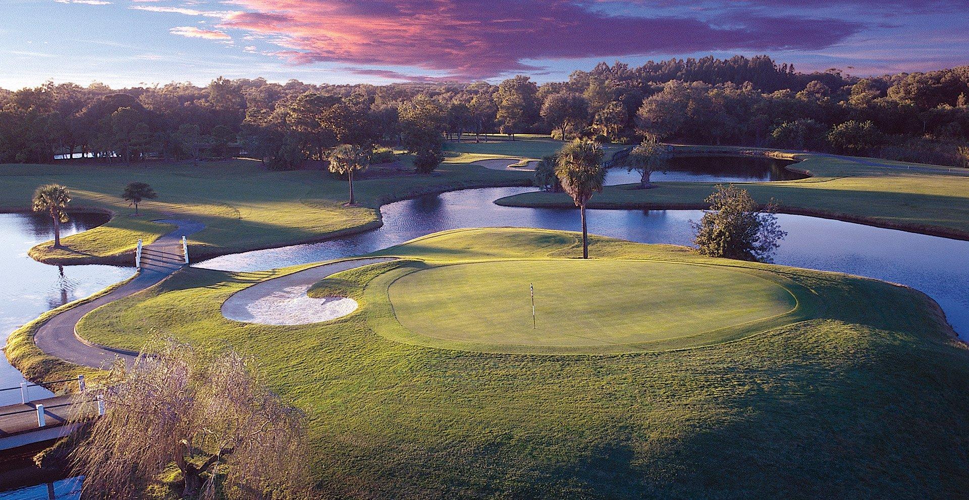 Overhead view of an island green surrounded by water with bridges to navigate the course