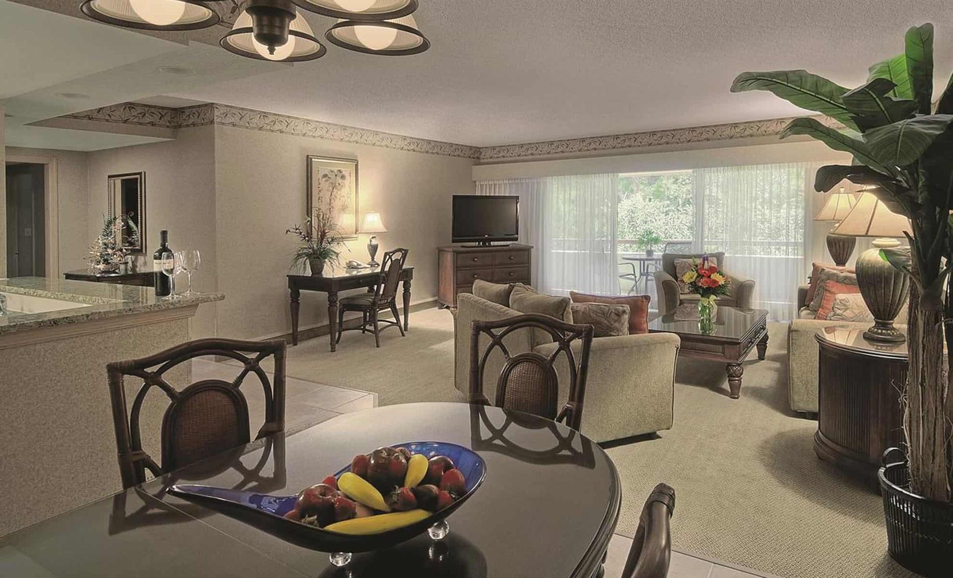 Sitting room in one of the villas with a balcony with beautiful nature views
