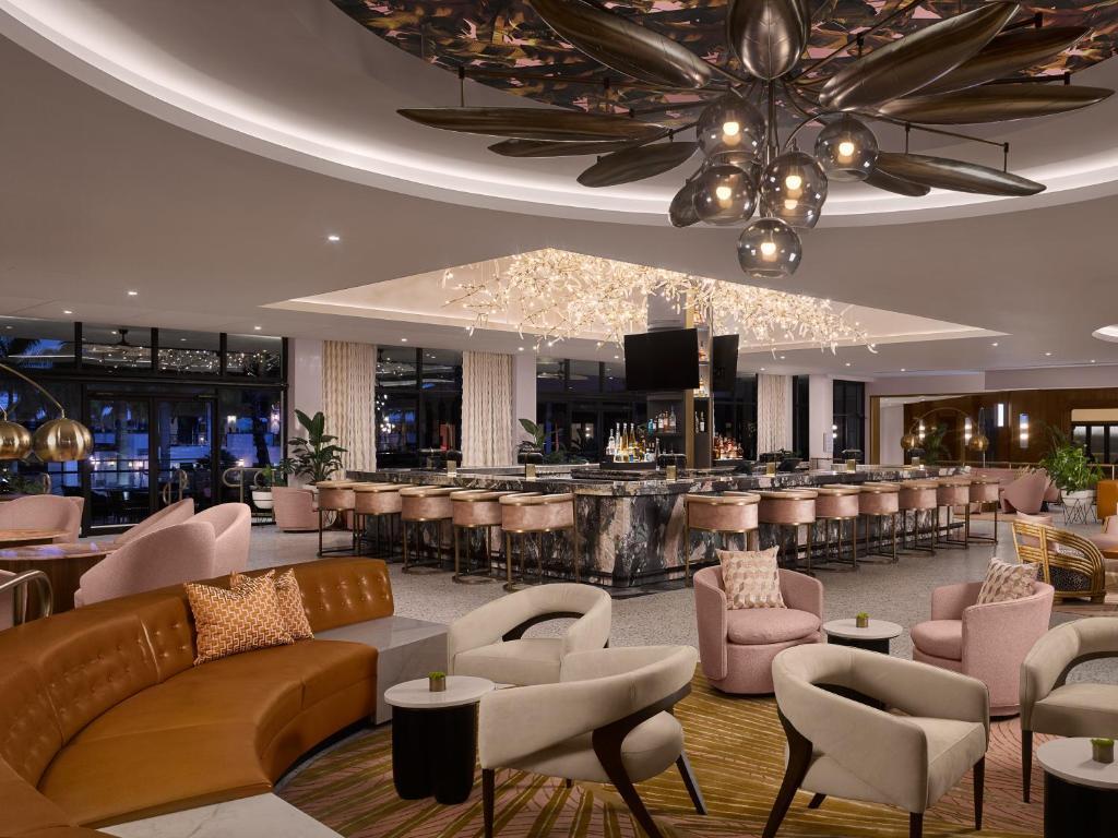Bar at the PGA National resort following a pink and cream design with a very modern design
