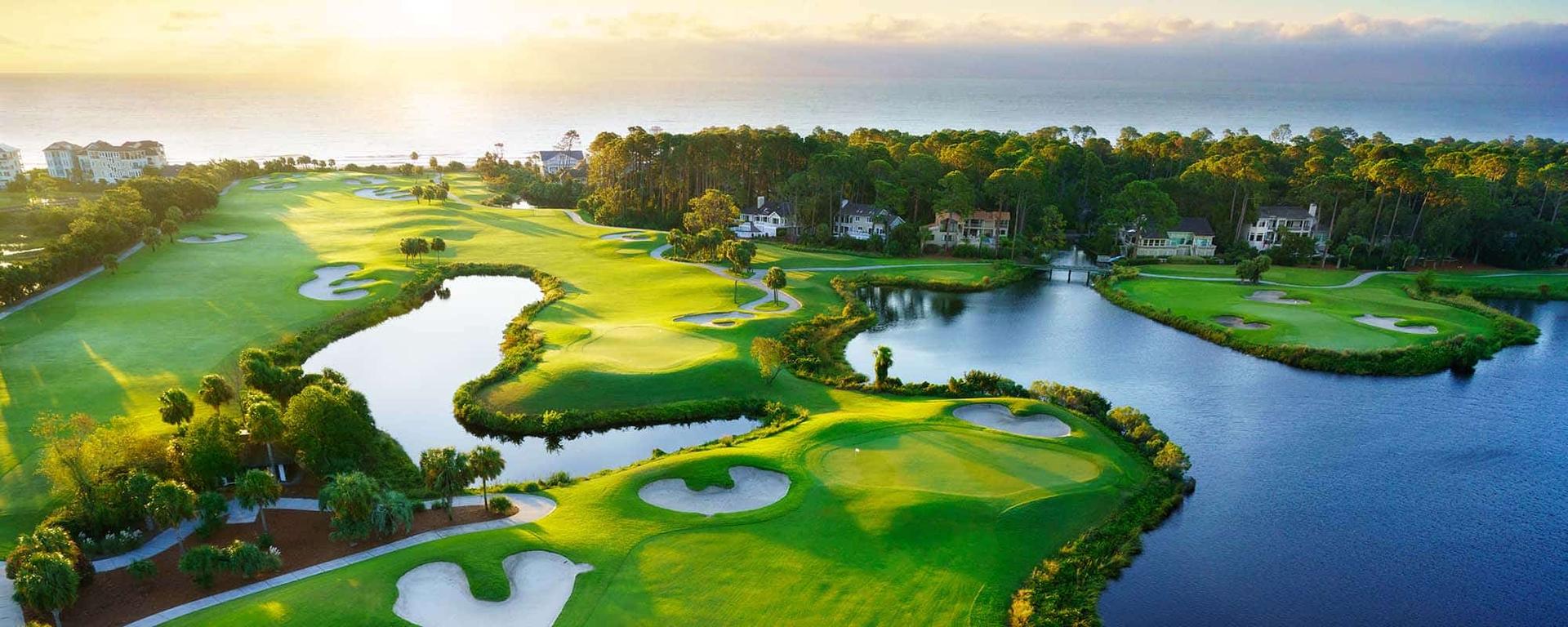 Sun setting over the Palmetto Dunes Oceanfront golf course which is scattered with sand bunkers