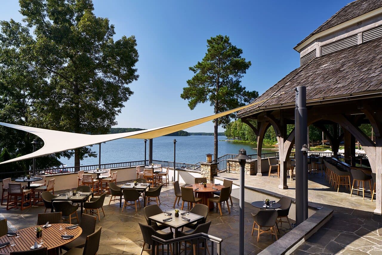 Outdoor seating area with a bar and coastal views