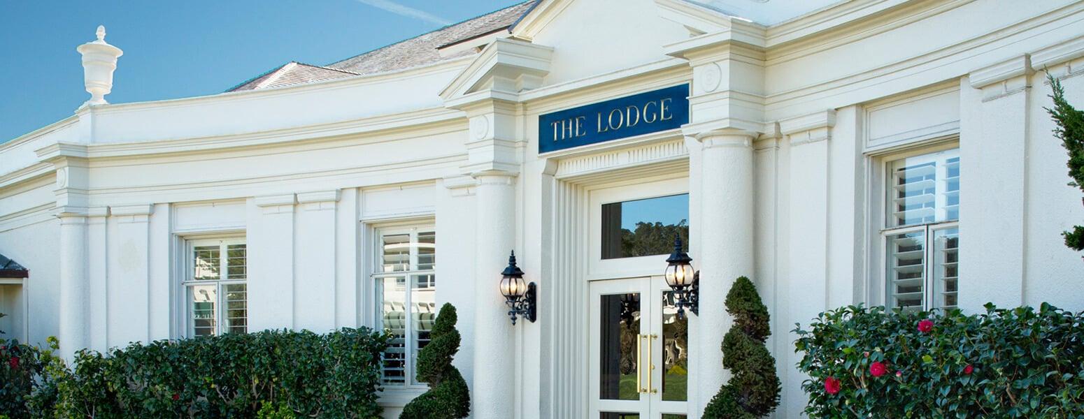 Font entrance to the lodge with a clean white design to the building