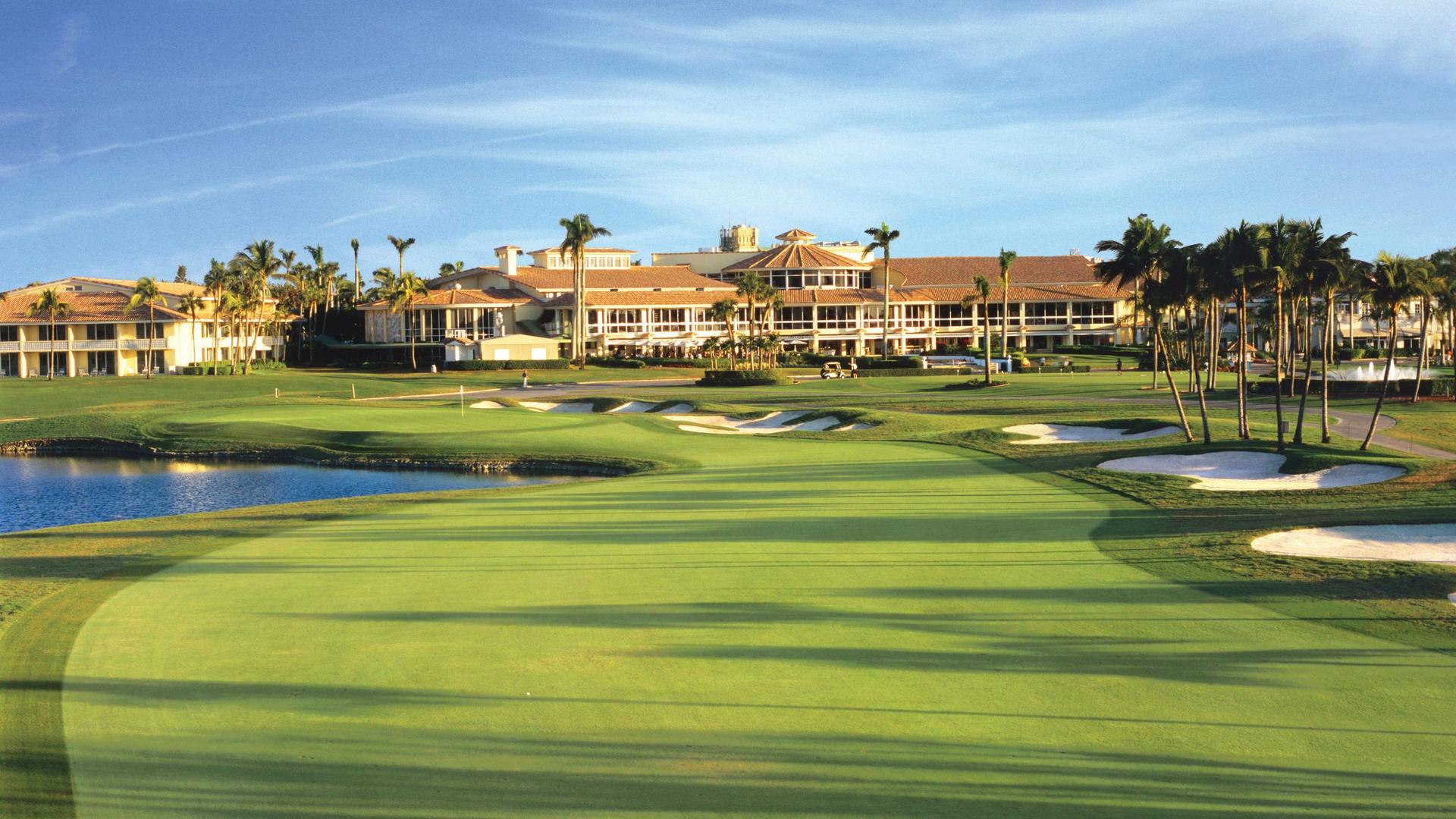 Well maintained fairway leading to a smooth green being look over by the Trump National Doral clubhouse