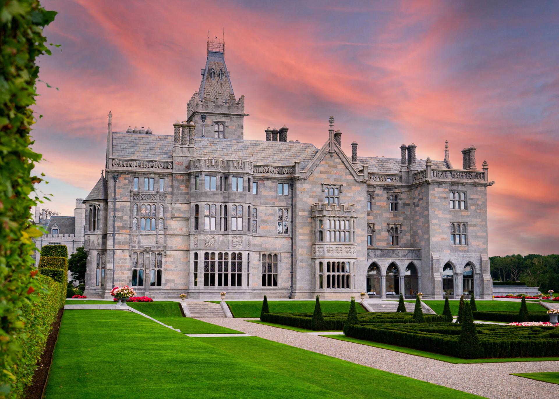 Vibrant sunset casting a warm glow over the historic castle.