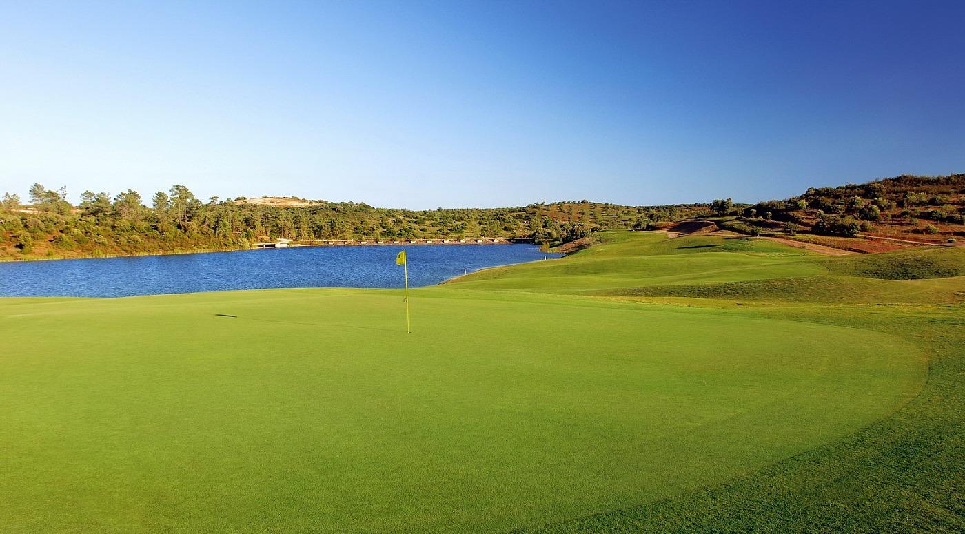 Pristine green with a water hazard behind it