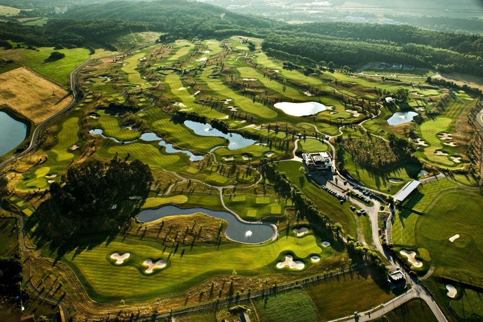 Aerial view of the Albatross Golf Resort littered with water hazards and sand bunkers