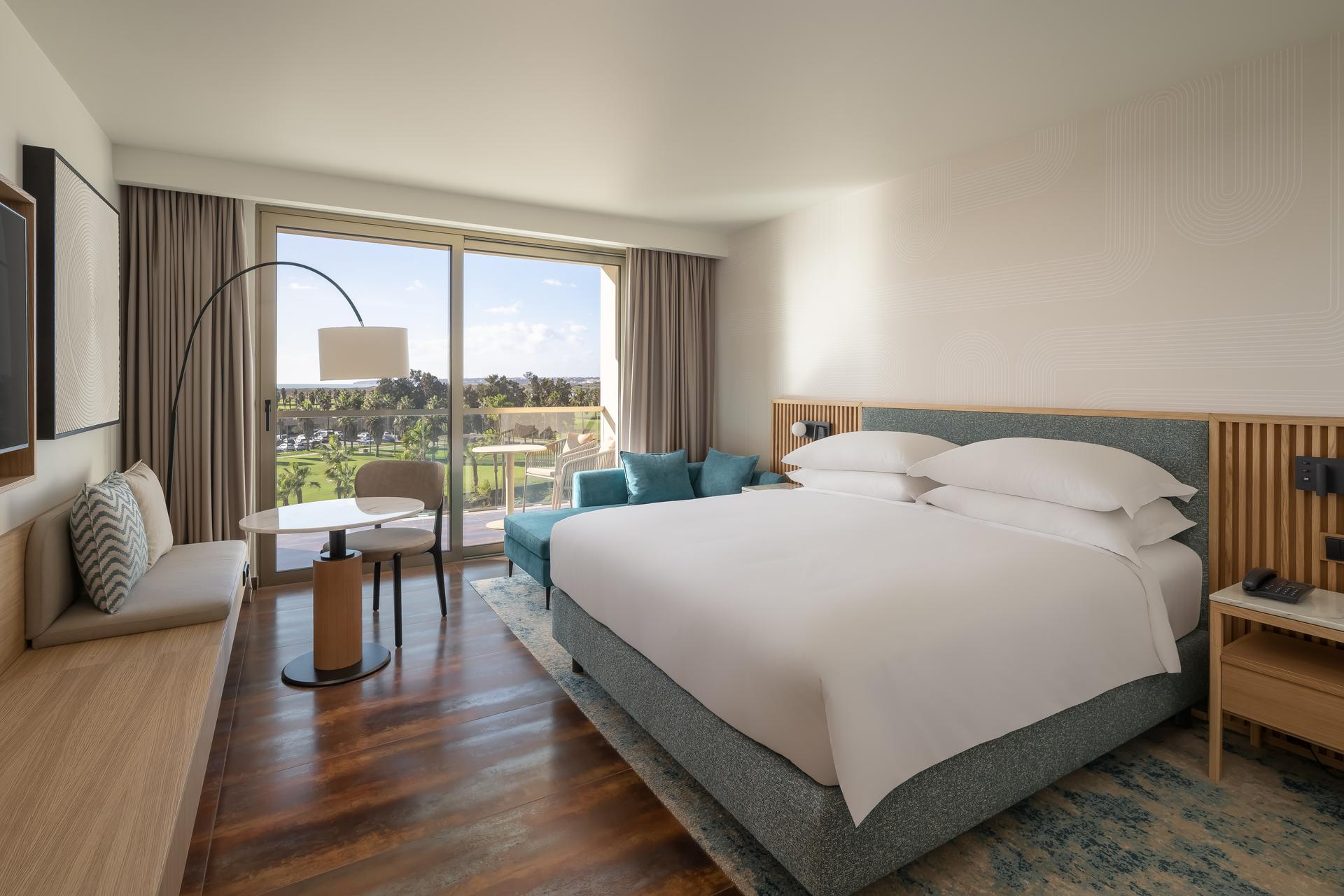 Double bed with a balcony in a double room
