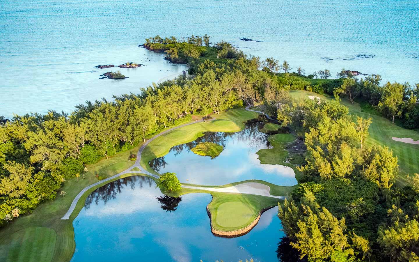 Overhead view of the Ambre Resort & Spa with two large water hazards