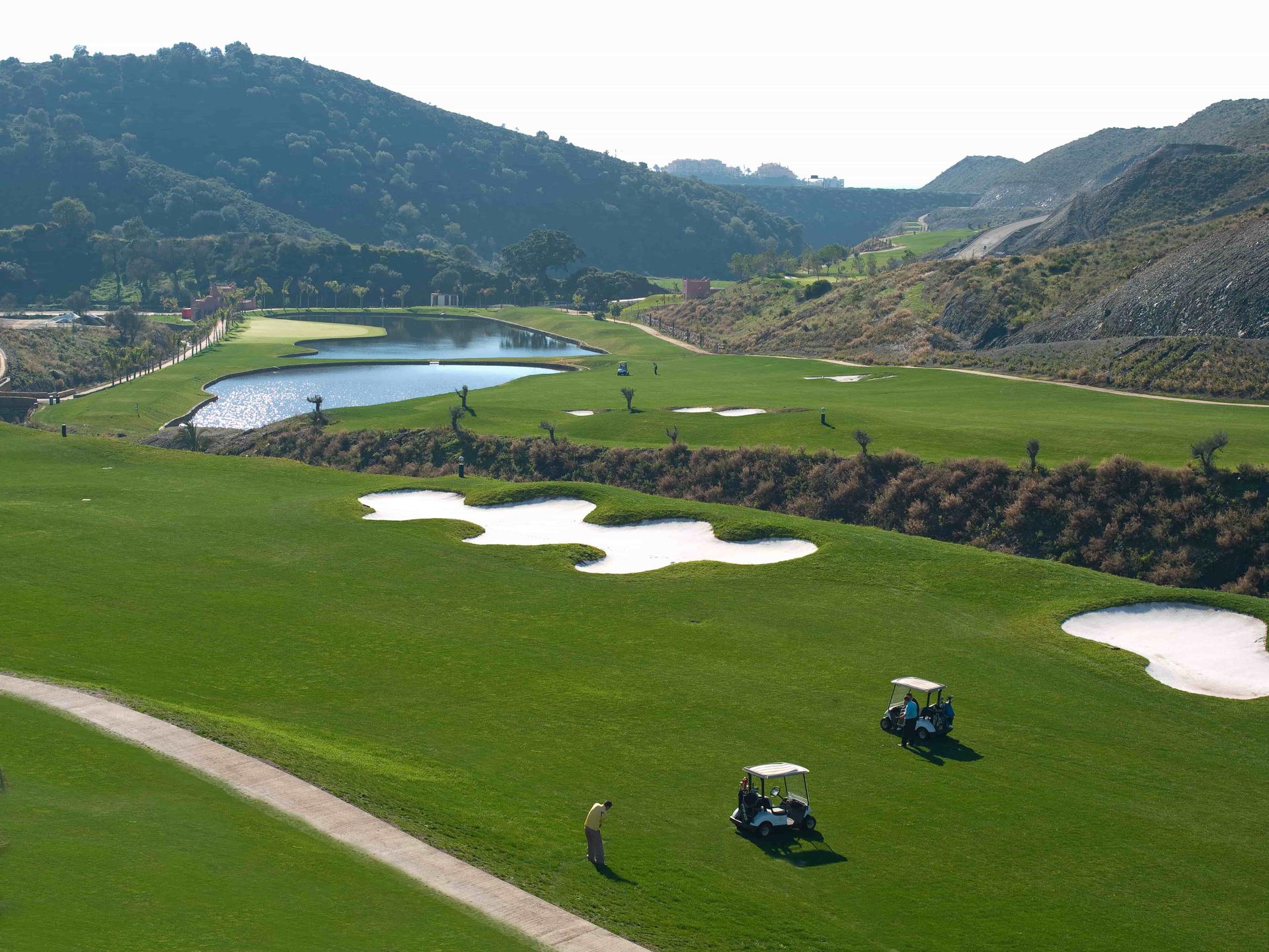 Pristine fairways with water hazards and hills