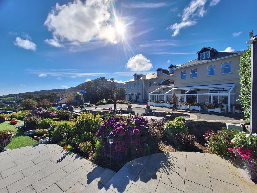 Ballyliffin lodge with colourful flowers and the sun shining down on the land