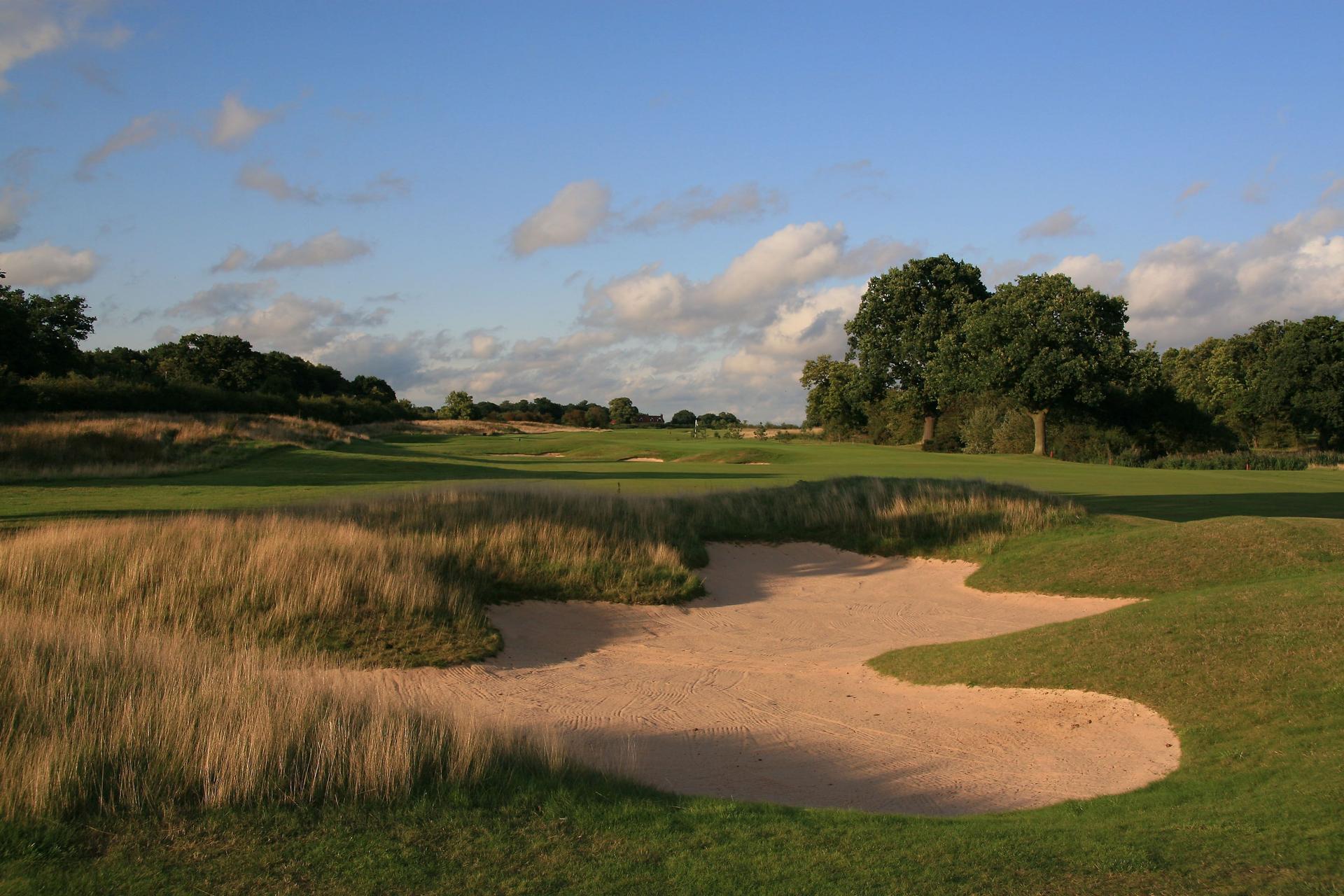Strategically placed bunkers at the Bracken Course on a sunny evening