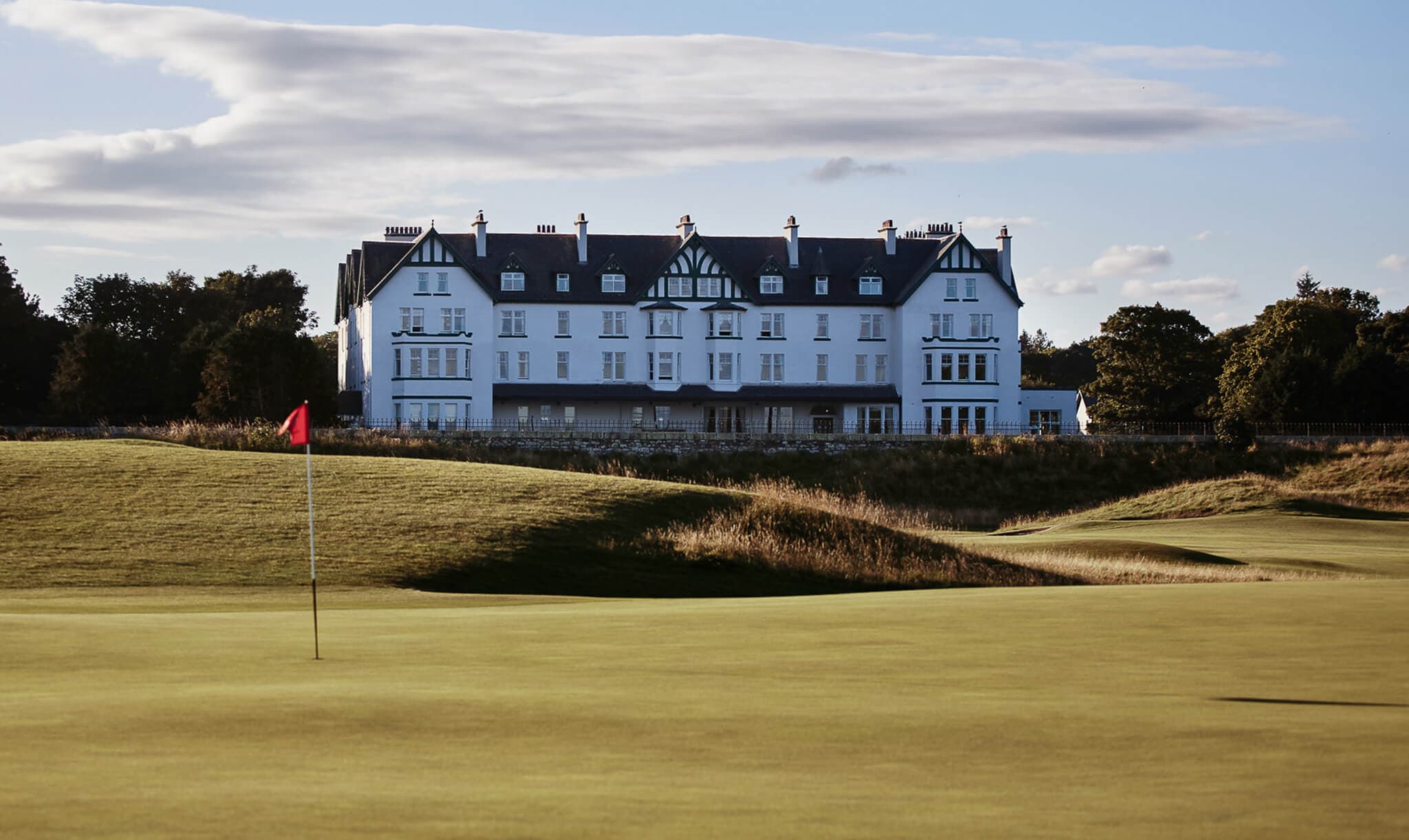 Exterior view of the Clubhouse at the hotel looking over the greens