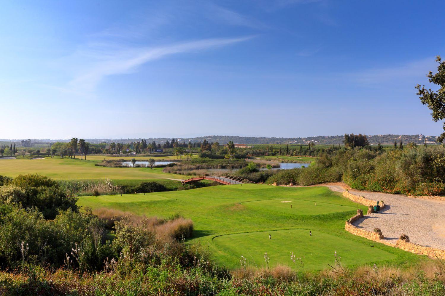 Tee shot over water to a wide open fairway