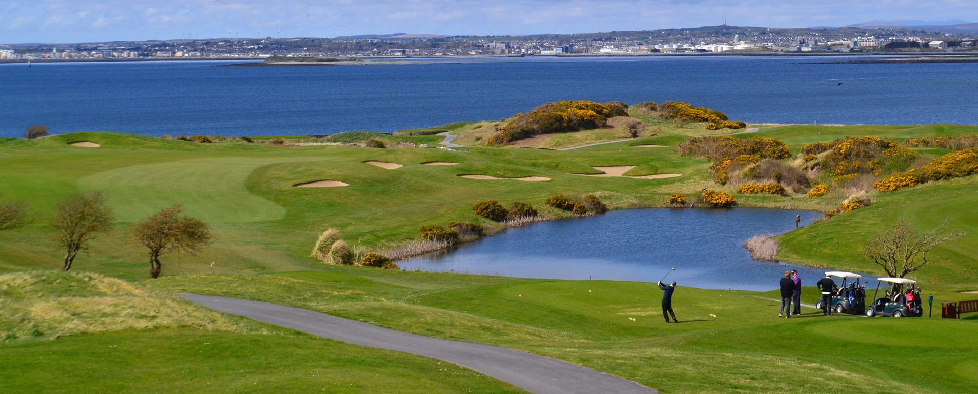 Overview of golfers tee'ing off ready to enjoy a round of golf at the Galway Bay Golf Course