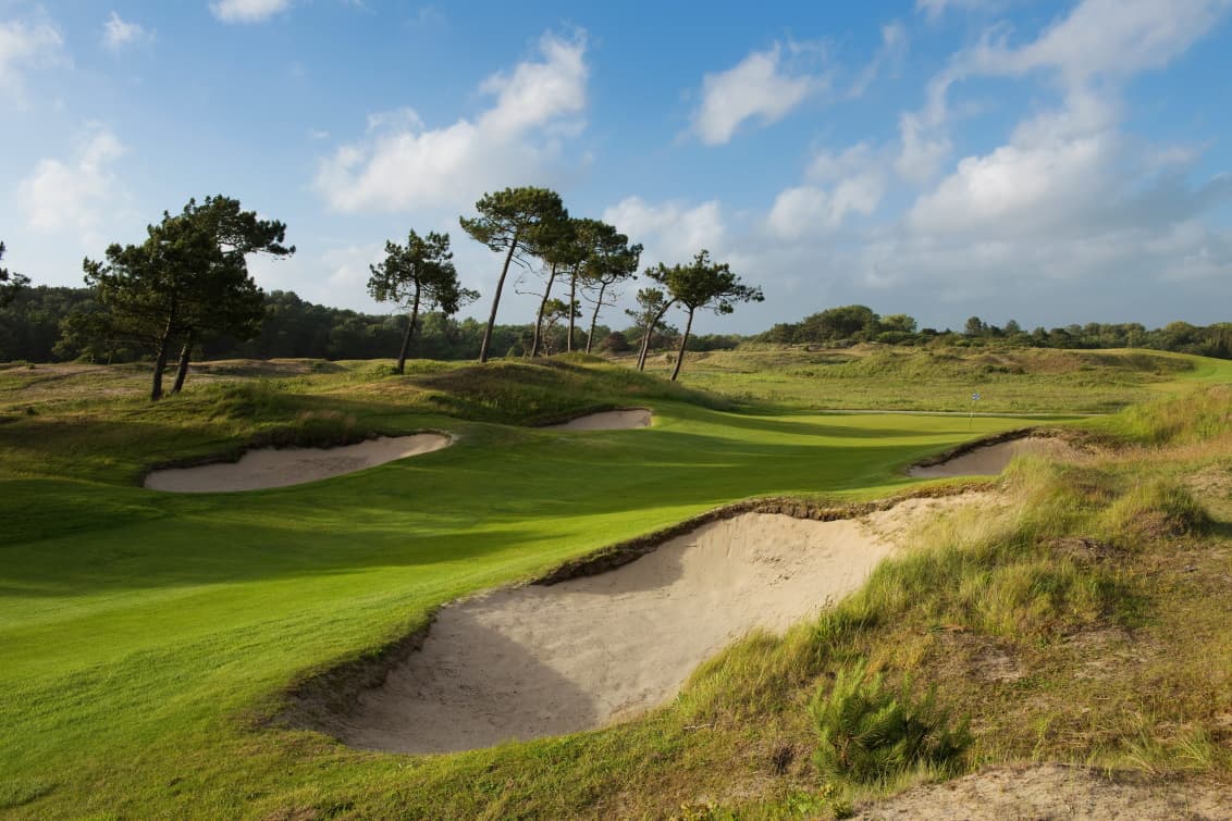 Narrow fairway flanked with bunkers