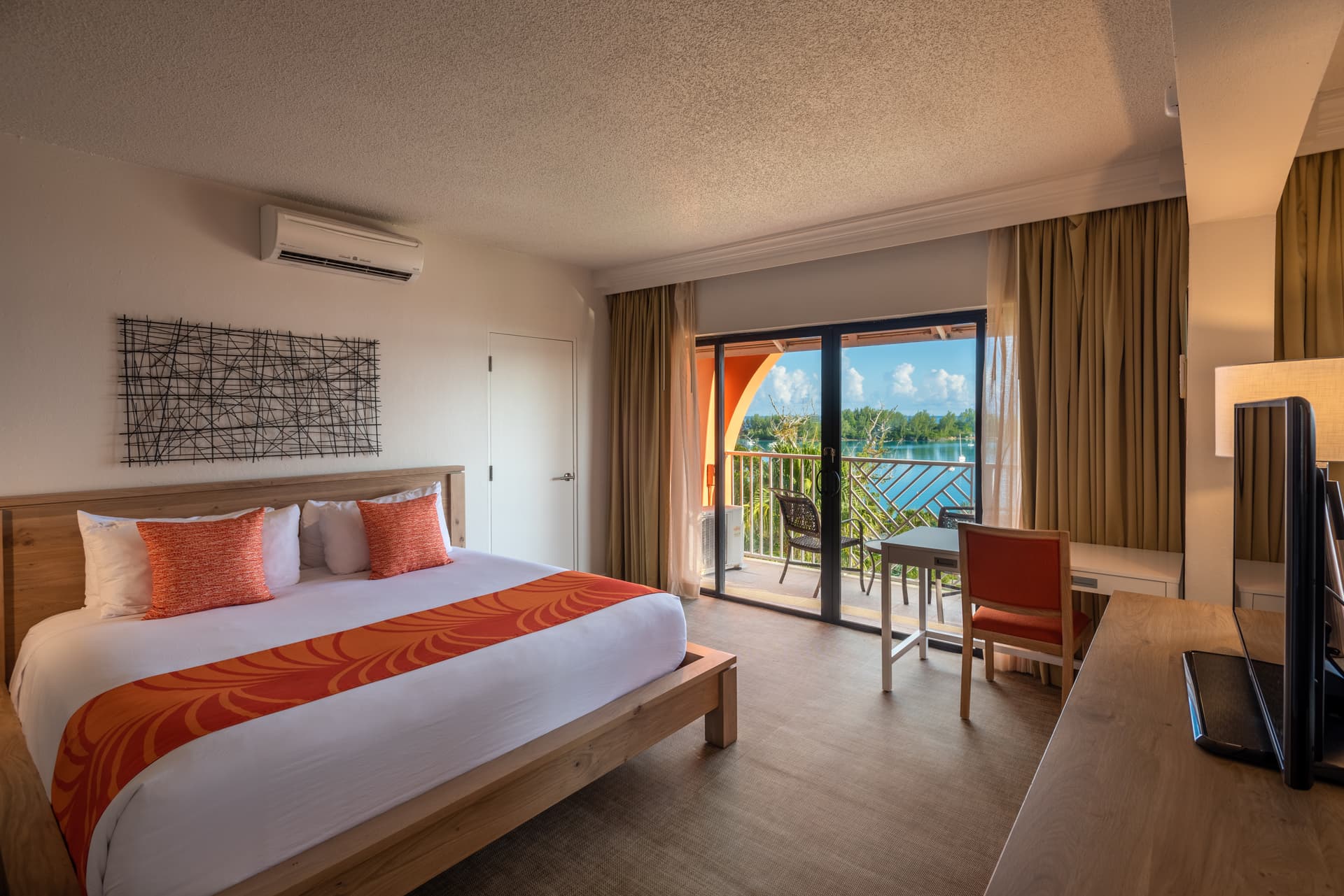 Double bed room at the Grotto Bay Beach Resort with sea views from the balcony