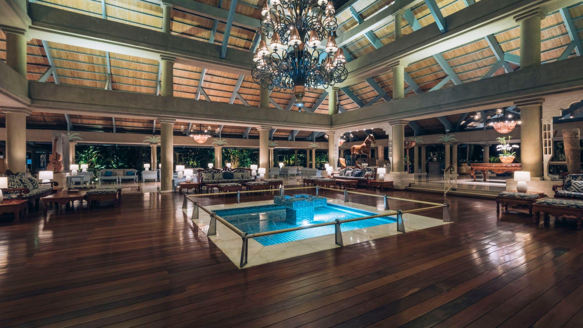 Indoor dining room at the hotel with a grand chandler handing over a water fountain centre piece