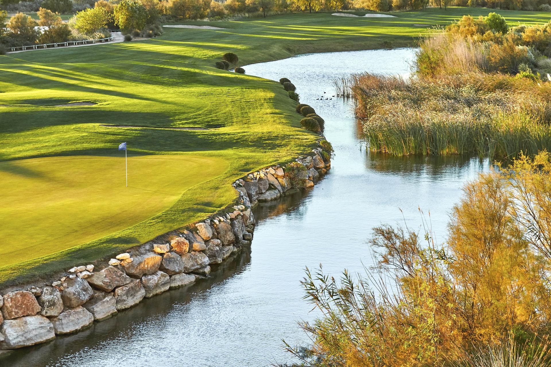 Green with water hazard next to it
