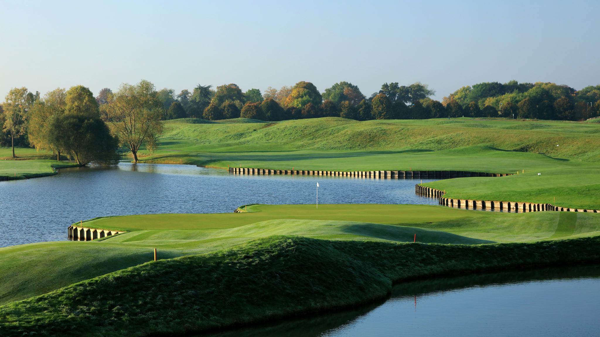 Undulating green surrounded by water