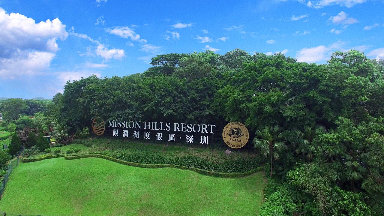 The Mission Hills Resort sign amongst nature at the resorts entrance