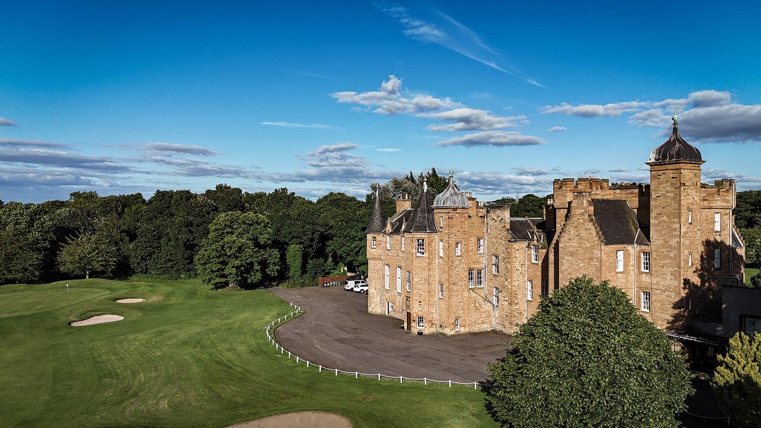 A close view of the historic castle next to the golf course.