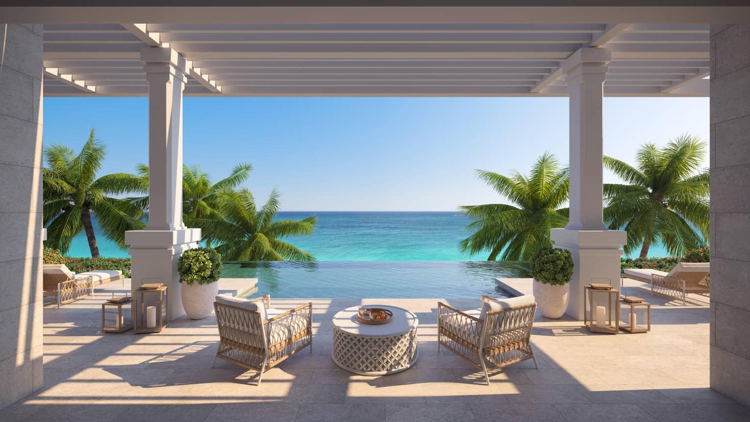 Infinity pool with sunbeds and ocean views