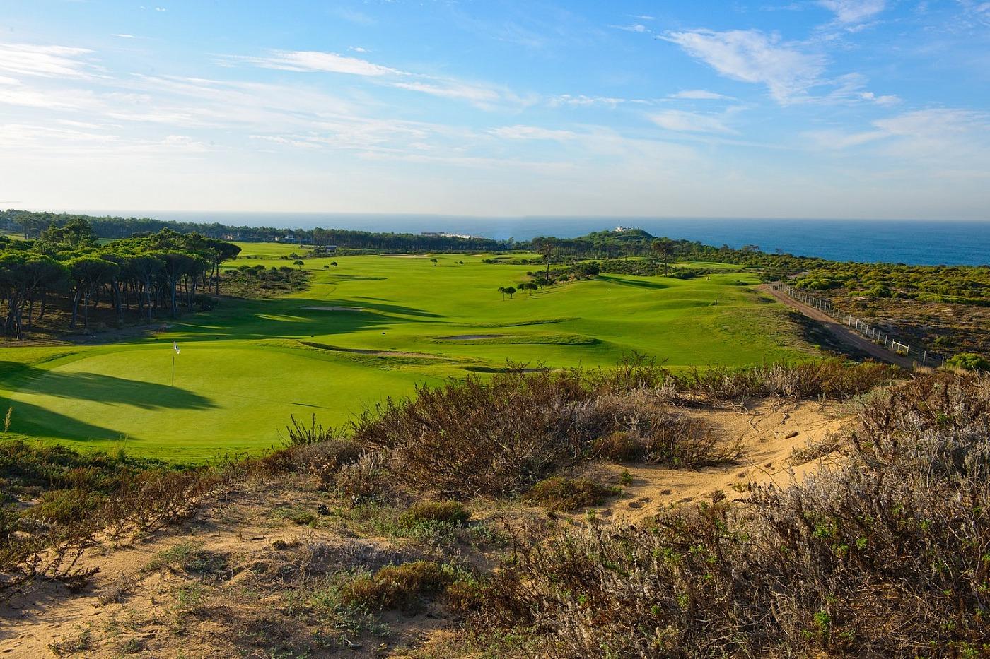 Wide open fairway leading to an undulating green with bunkers in front