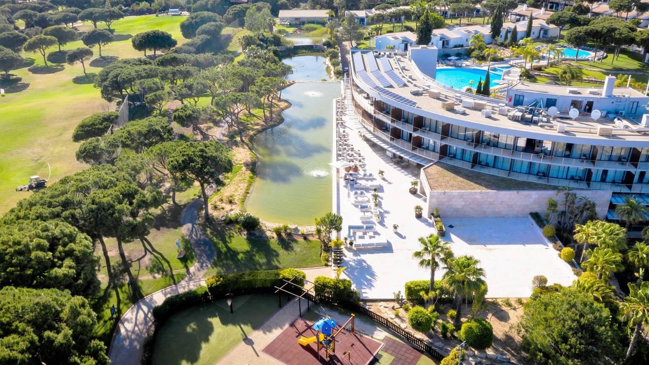 Aeria view of the hotel with swimming pool visible