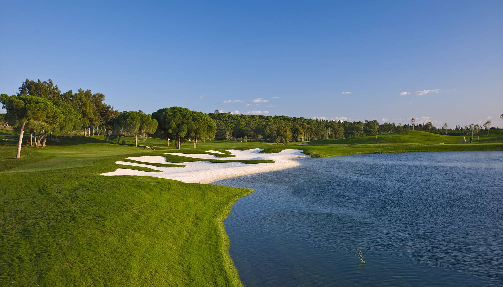 Large bunker next to a water hazard
