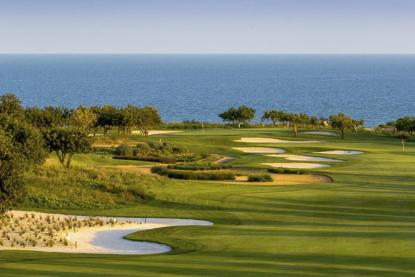 Winding fairway interspersed by bunkers